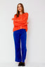 lauren-cardigan-gebreid-oranje-knoopsluiting-ribversieringen-sweet-like-you-model-vooraanzicht-1