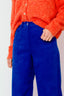 lauren-cardigan-gebreid-oranje-knoopsluiting-ribversieringen-sweet-like-you-model-close-up-1