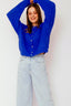 lauren-cardigan-gebreid-blauw-knoopsluiting-ribversieringen-sweet-like-you-model-vooraanzicht-1