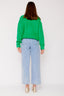 lauren-cardigan-gebreid-groen-knoopsluiting-ribversieringen-sweet-like-you-model-achteraanzicht-1