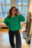 lauren-cardigan-gebreid-groen-knoopsluiting-ribversieringen-sweet-like-you-selfie-vooraanzicht-1