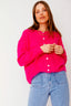 lauren-cardigan-gebreid-fuchsia-knoopsluiting-ribversieringen-sweet-like-you-model-vooraanzicht-1