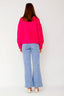 lauren-cardigan-gebreid-fuchsia-knoopsluiting-ribversieringen-sweet-like-you-model-achteraanzicht-1