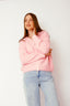 lauren-cardigan-gebreid-roze-knoopsluiting-ribversieringen-sweet-like-you-model-vooraanzicht-1