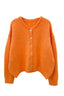 lauren-cardigan-gebreid-oranje-knoopsluiting-ribversieringen-sweet-like-you-productfoto-vooraanzicht-1