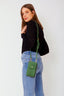 grace-schoudertas-met-drukknoop-suede-leer-groen-sweet-like-you-model-vooraanzicht-1