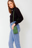 grace-schoudertas-met-drukknoop-suede-leer-groen-sweet-like-you-model-vooraanzicht-2