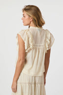 jayla-voile-top-light-yellow-v-hals-mouwloos-modelfoto-achteraanzicht-1